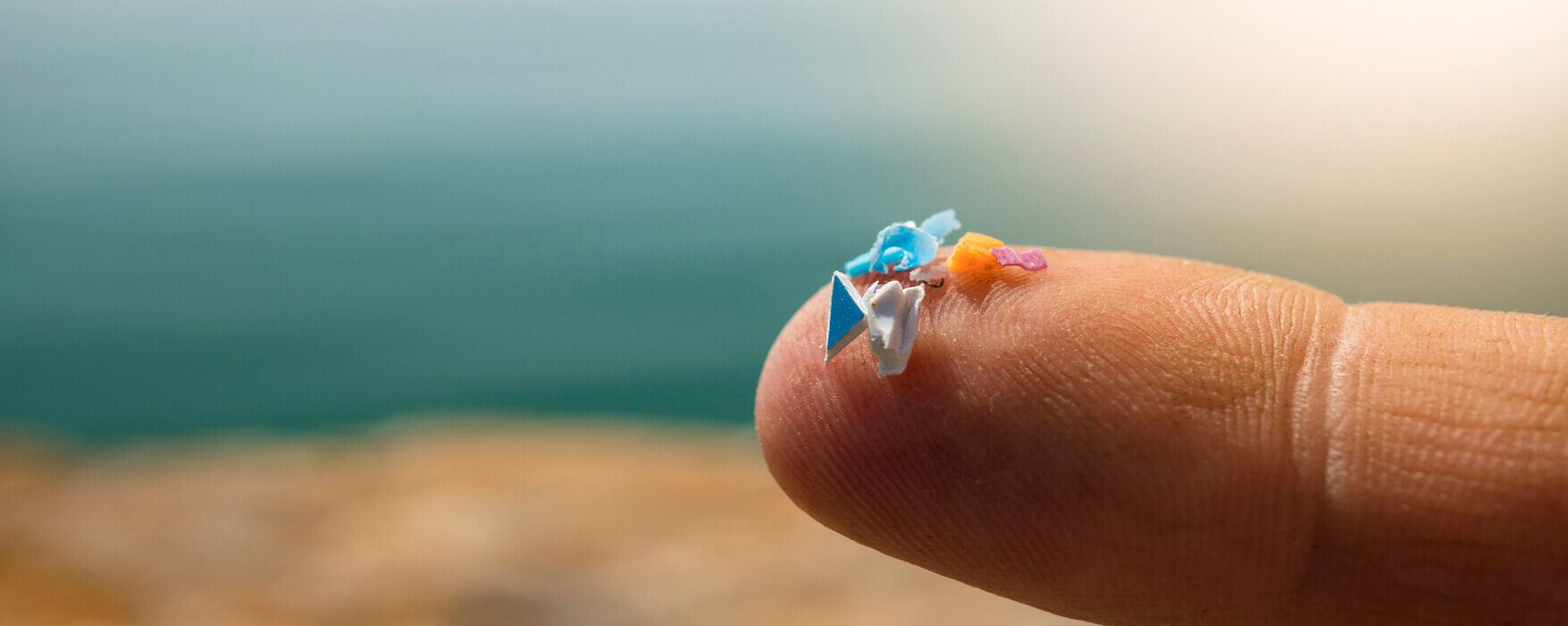 macro-shot-microplastics-human-fingers-concept-water-pollution-with-microplastic